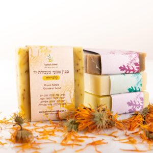A collection of four soaps in a variety of fragrances and colors