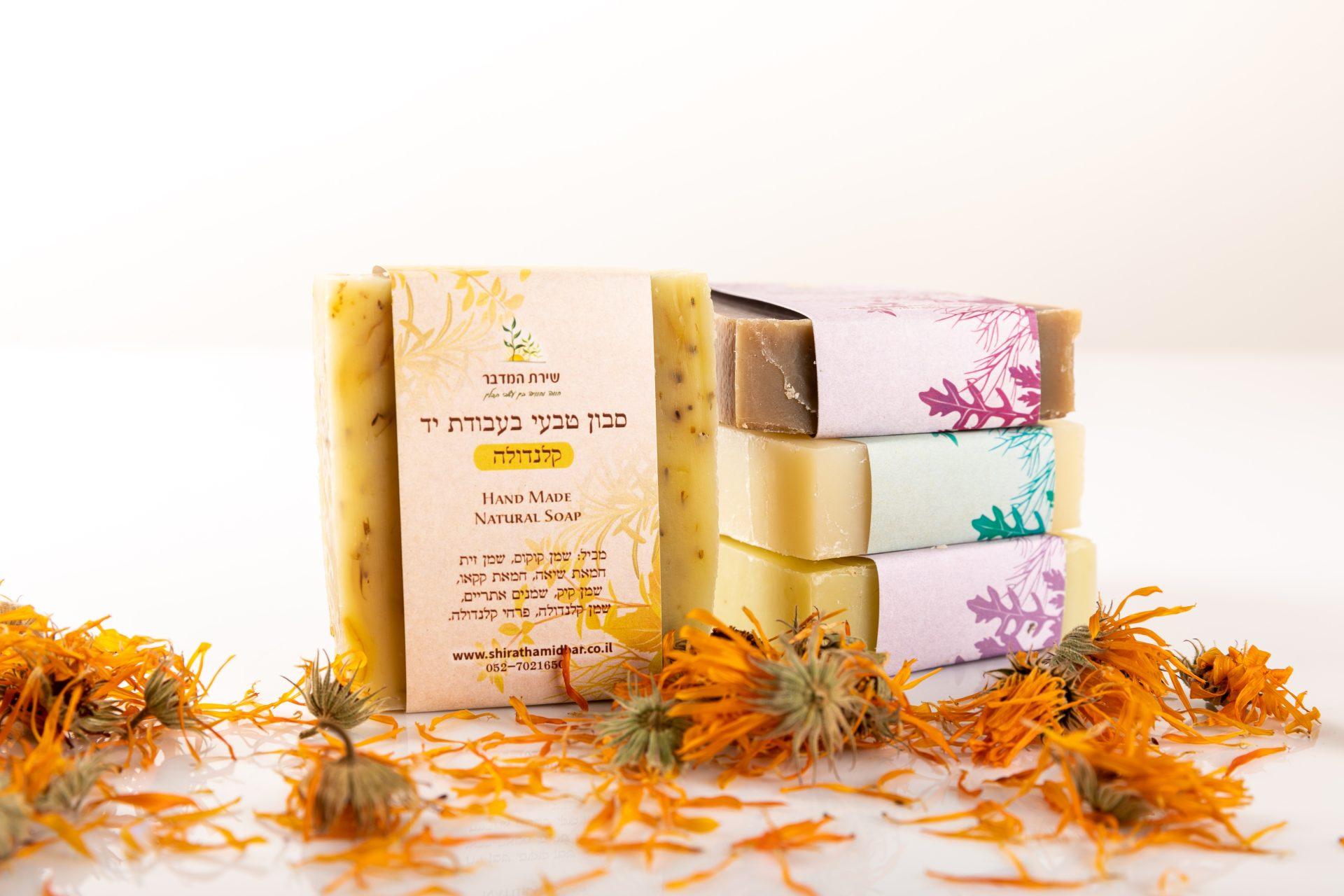 A collection of 4 soaps in a variety of fragrances and colors